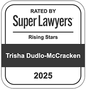 Square badge labeled "Rated by Super Lawyers, Rising Stars 2025," featuring the name "Trisha Dudlo-McCracken" on a dark horizontal band. Professional recognition.